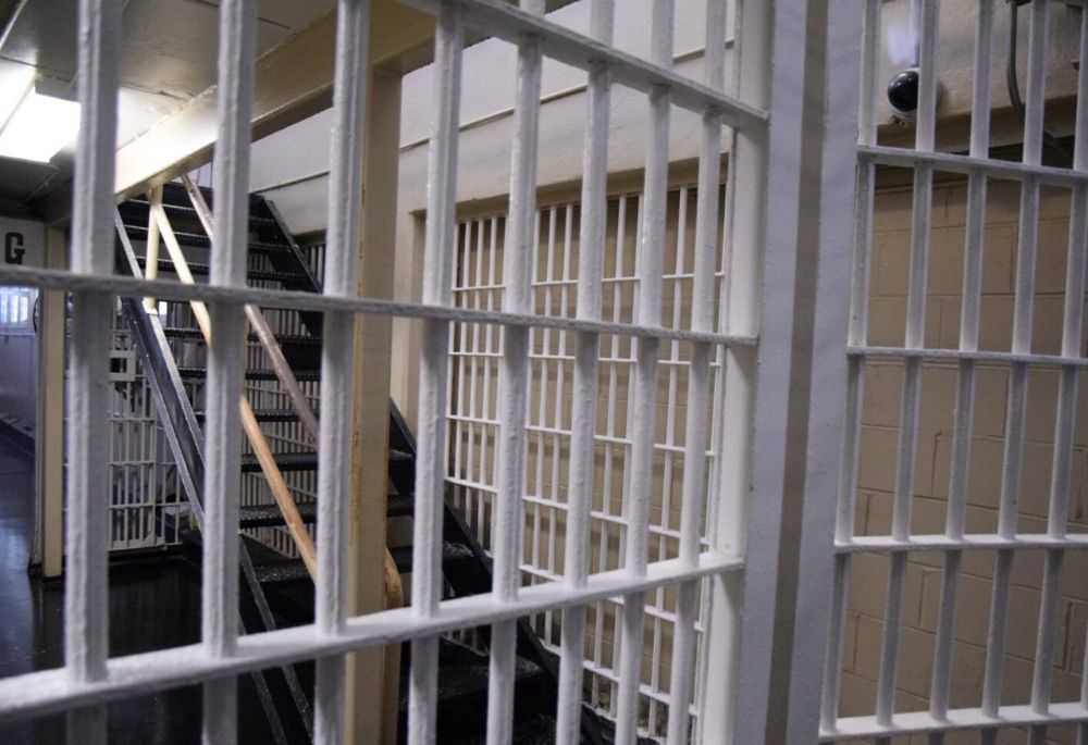 Prison cell bars and staircase, relevant to immigration and visa case.