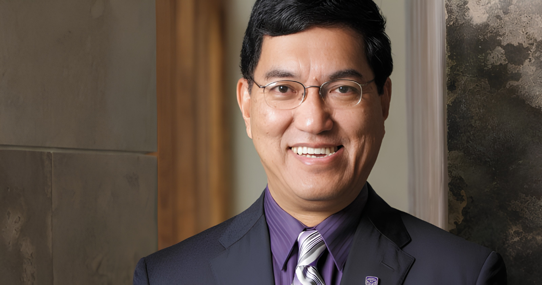 Amit Chakma, a business leader, smiles in a professional portrait.