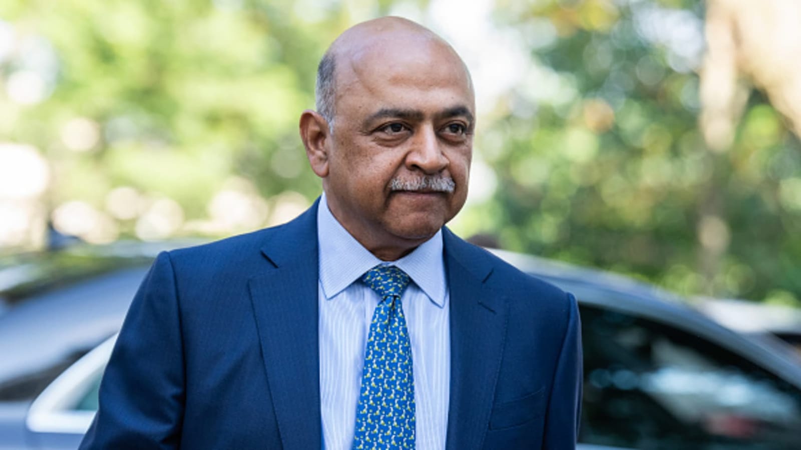 IBM CEO Arvind Krishna in a blue suit, discussing business and quantum computing