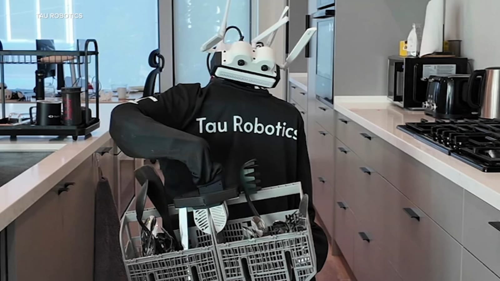 Tau Robotics humanoid robot loading a dishwasher in a San Francisco home