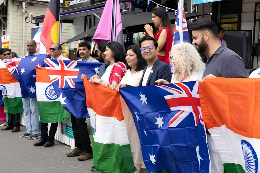 Indian and Australian flags at a multicultural event, reflecting diaspora influence on politics.