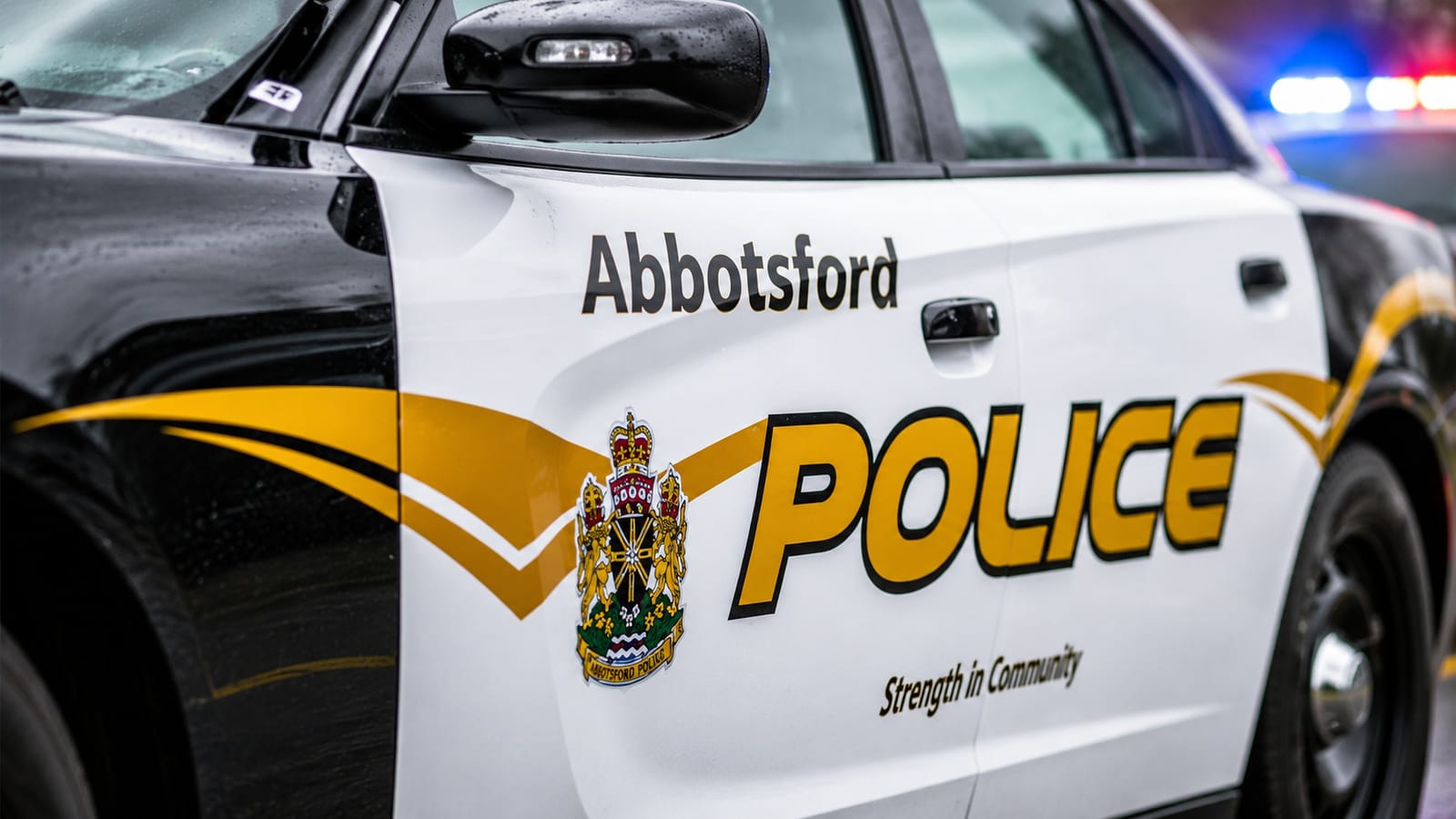 Abbotsford Police car with "POLICE" text and crest, relevant to news of a penalty.