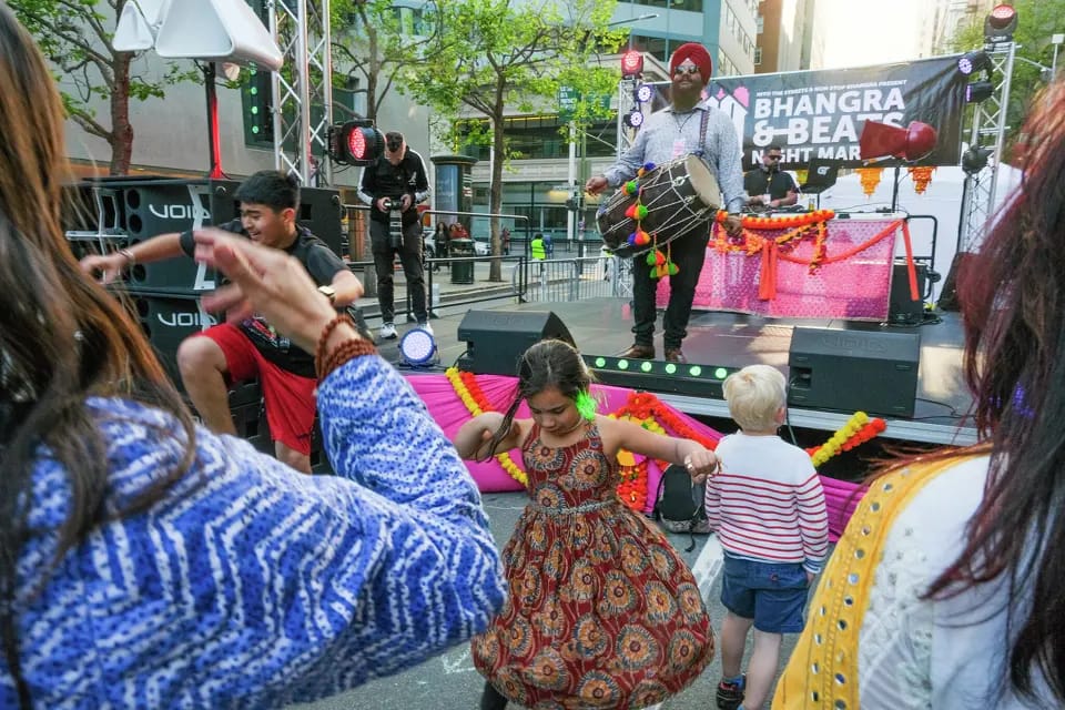 Bhangra & Beats Night Market in SF: People dancing to live music.