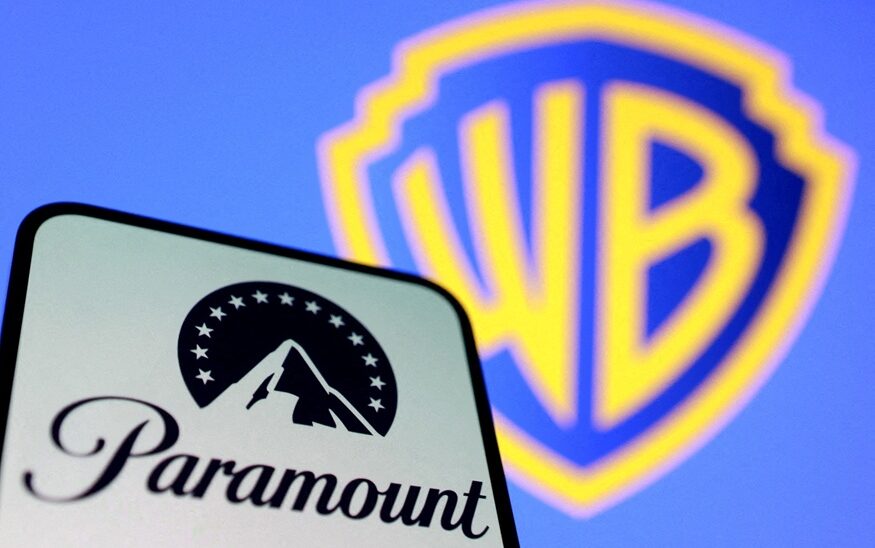 Paramount logo on smartphone screen with WB logo in background