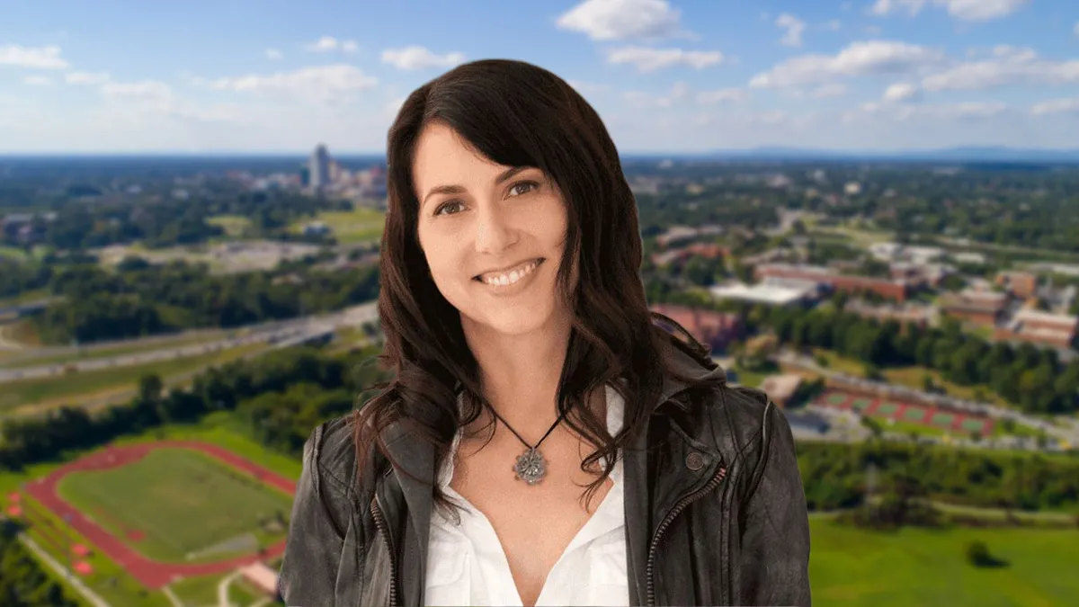 MacKenzie Scott, philanthropist, in front of a city skyline