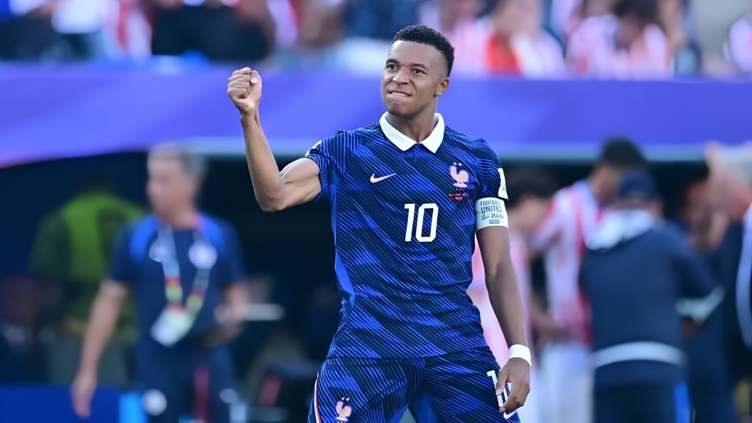Kylian Mbappé celebrates wearing France's #10 soccer jersey.