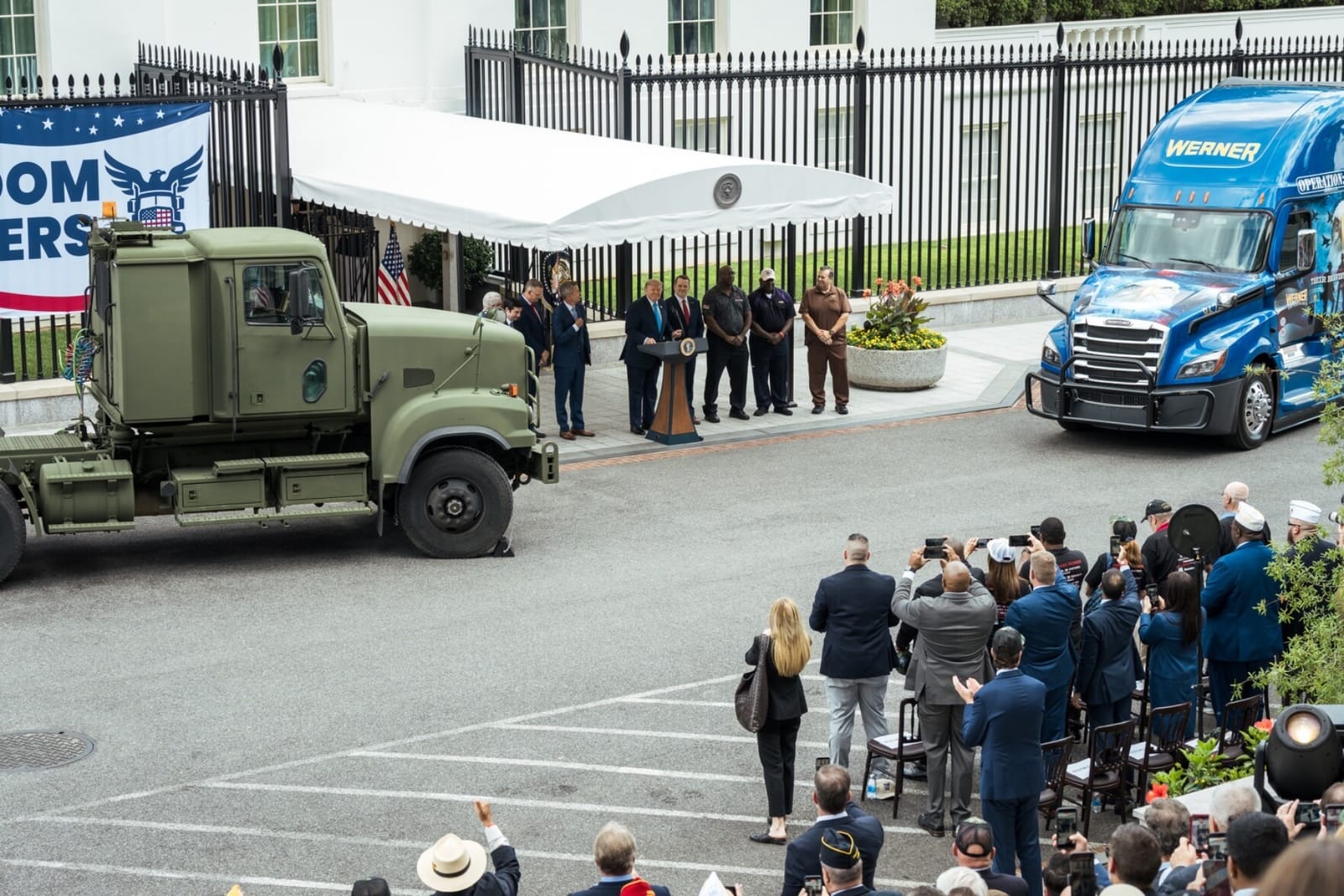 Trump launches Freedom Haulers program with military and Werner trucks at the White House.