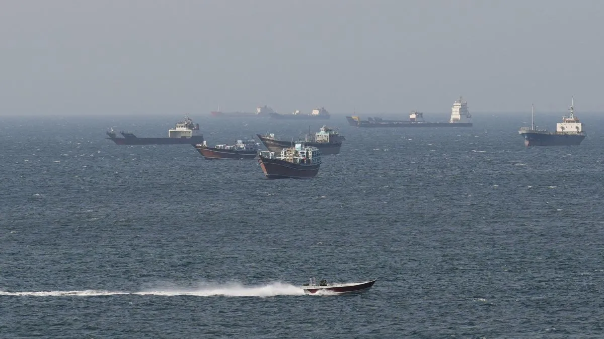 Ships in the Strait of Hormuz, a key route for global politics and trade.
