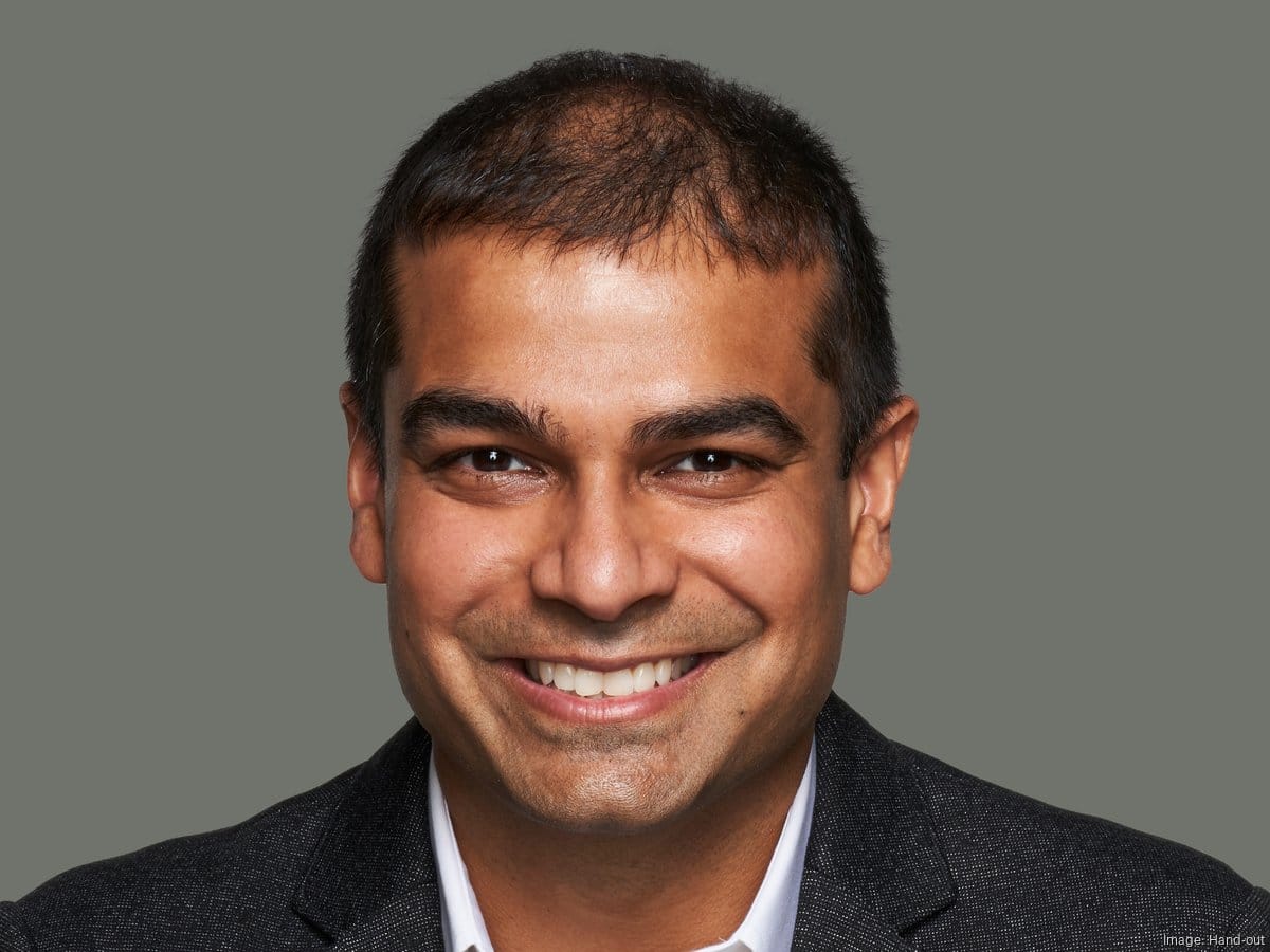 Rudy Sengupta, Emerson's new CTO and AI Chief, smiles for a tech portrait.