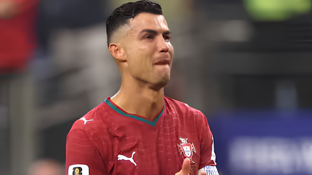 Cristiano Ronaldo in Portugal jersey, looking emotional during a sports match.