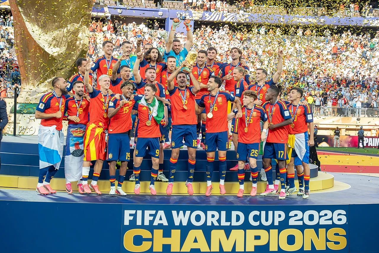 Spain's 2026 World Cup champions celebrate with trophy and confetti.
